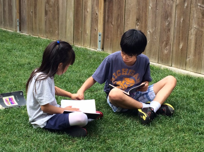 My kids working on wrecking their lenten journals.