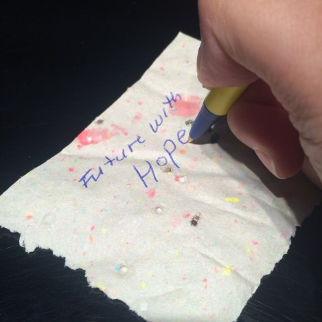 The colored paper is cut into squares.